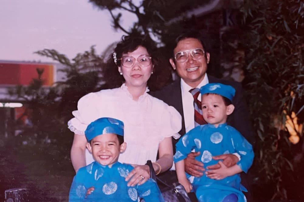 A family photograph: my parents with two small boys